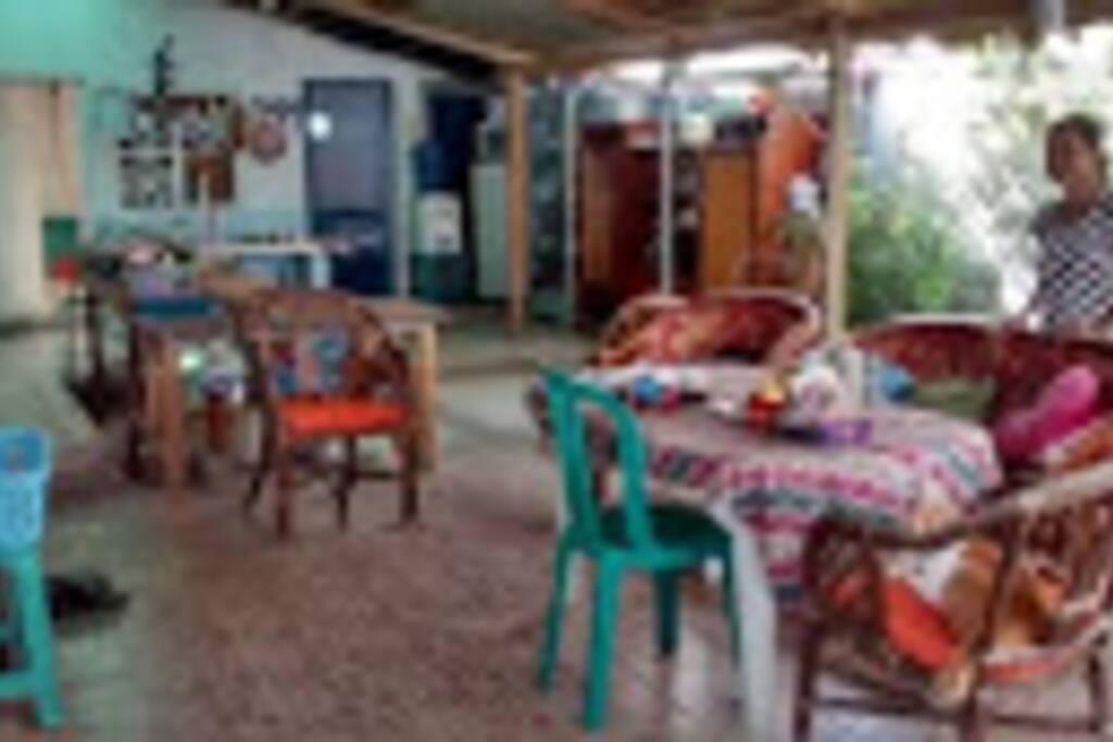 Outdoor relaxation and cooking area. Very cool as has traditional grass roof and breeze flows through