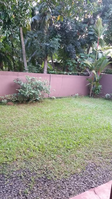 The front yard and entire home is enclosed by a gated wall.