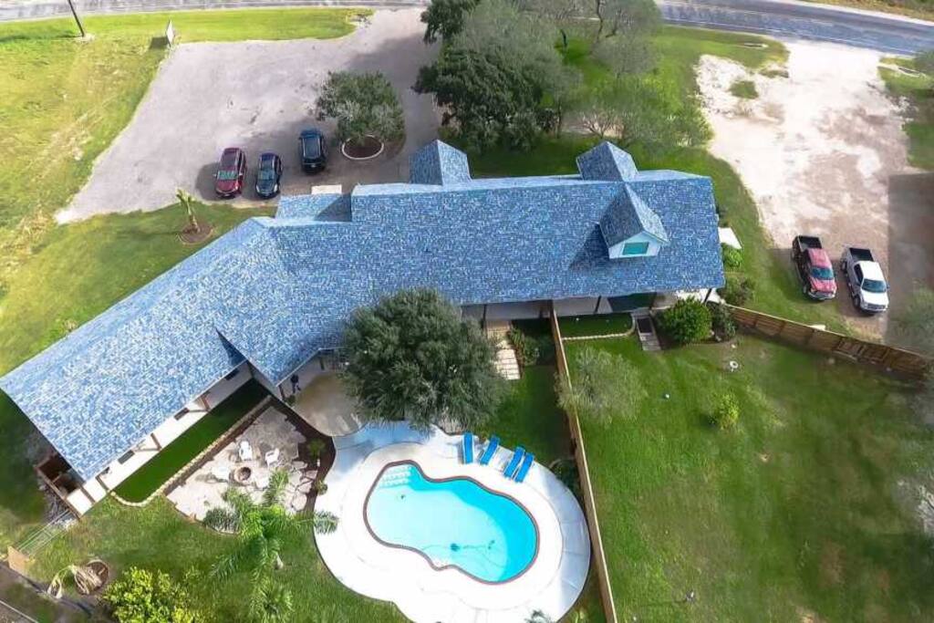 Close-up of lodge and pool from the air