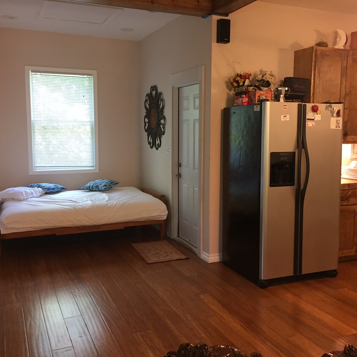 Secluded tree house apartment with high ceilings.