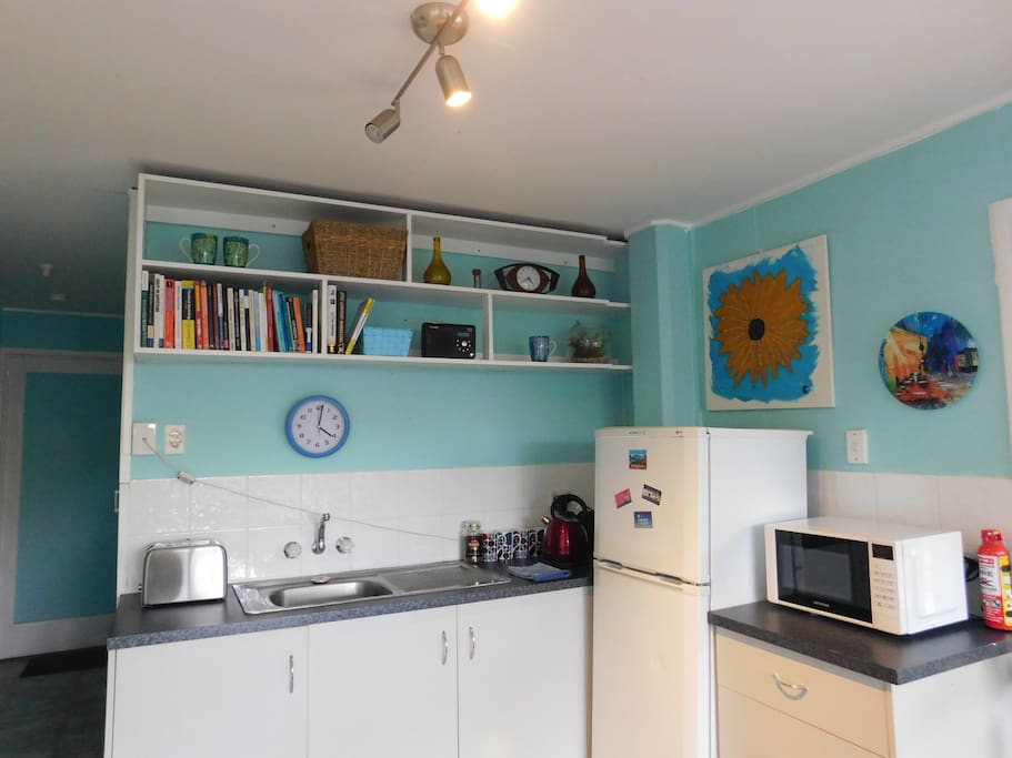 The kitchen area has fridge/freezer, microwave, toaster and kettle