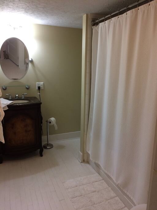 Extra long soaking tub and shower. Ample storage for extended stays.