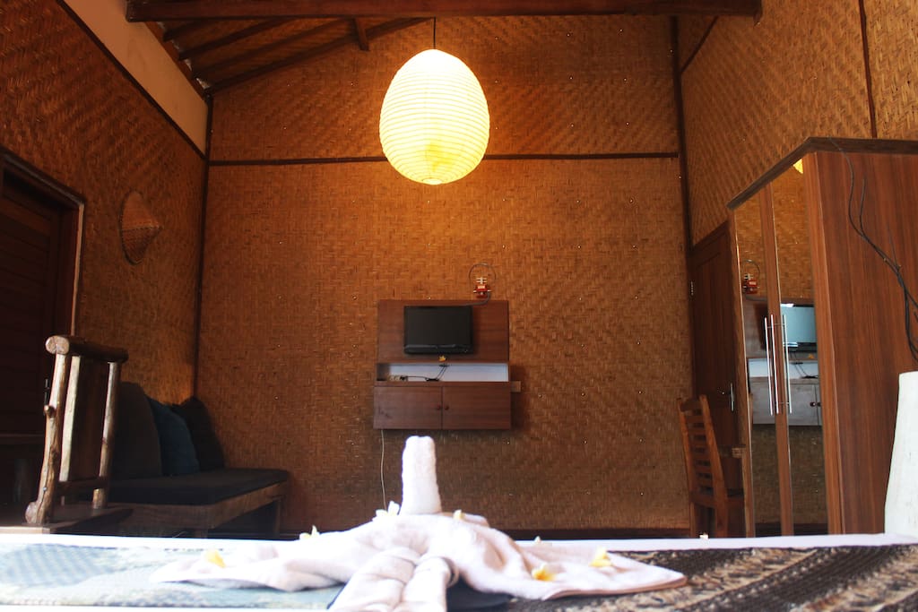 woden room with tv and cupboard