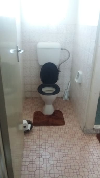 toilet with toilet paper provided