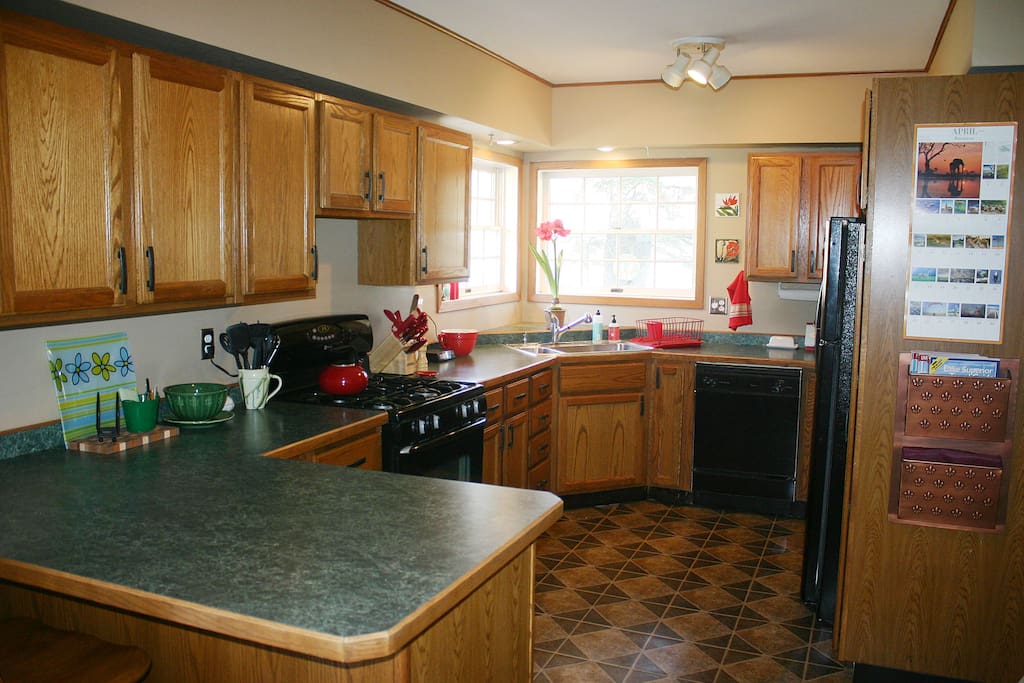 Our kitchen has a dishwasher, microwave, gas range and lots of cookware.