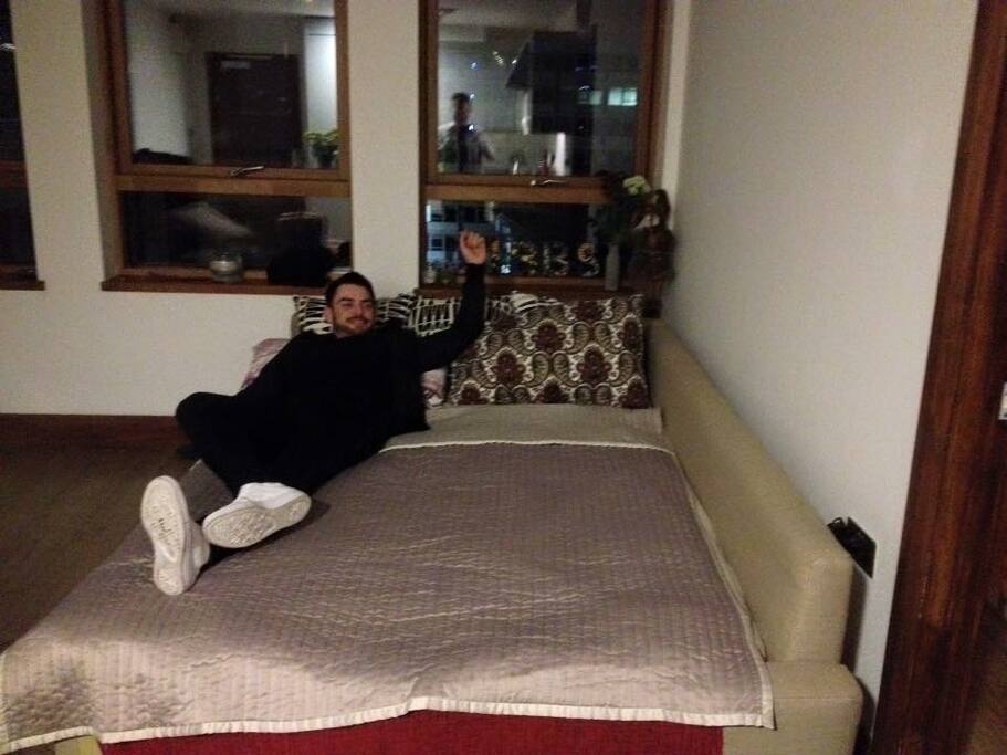 In the front room we have a corner sofa that doubles as an awesome pull out double.