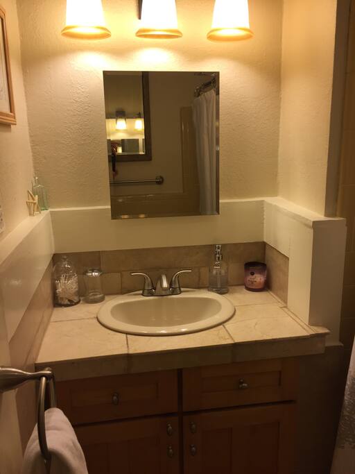 Sink area in private bath.