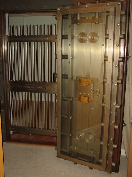 Bank vault door between beds