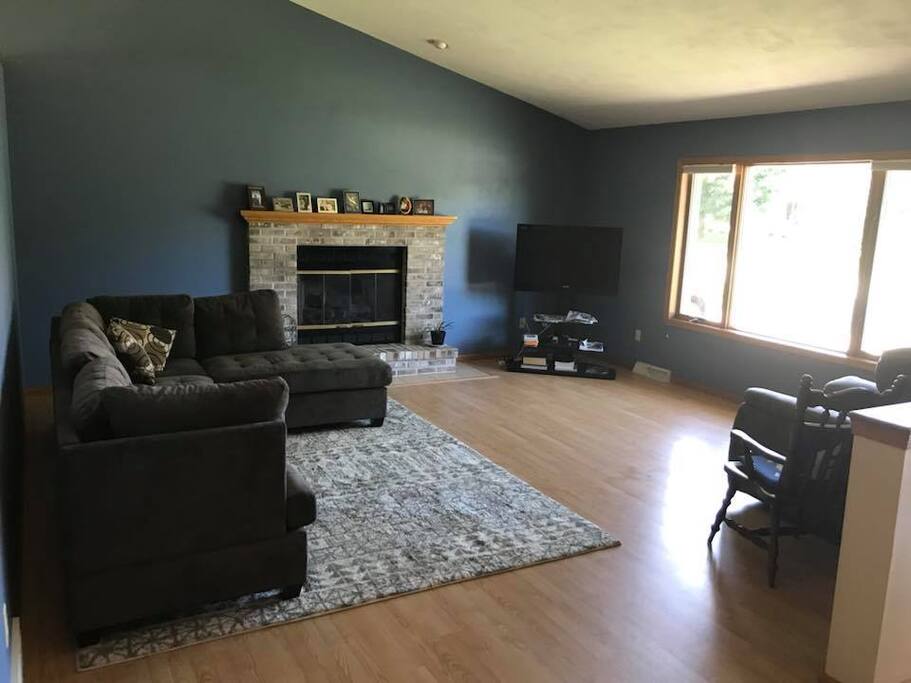Living room with brand new furniture and electric fireplace