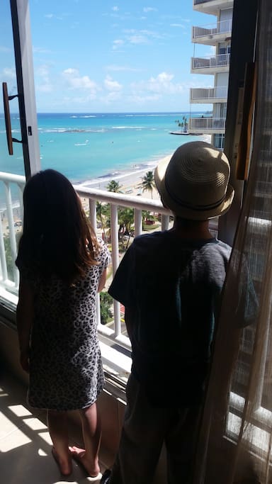 Watching the waves from the sliding glass wall
