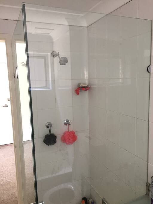 Shower in shared bathroom.