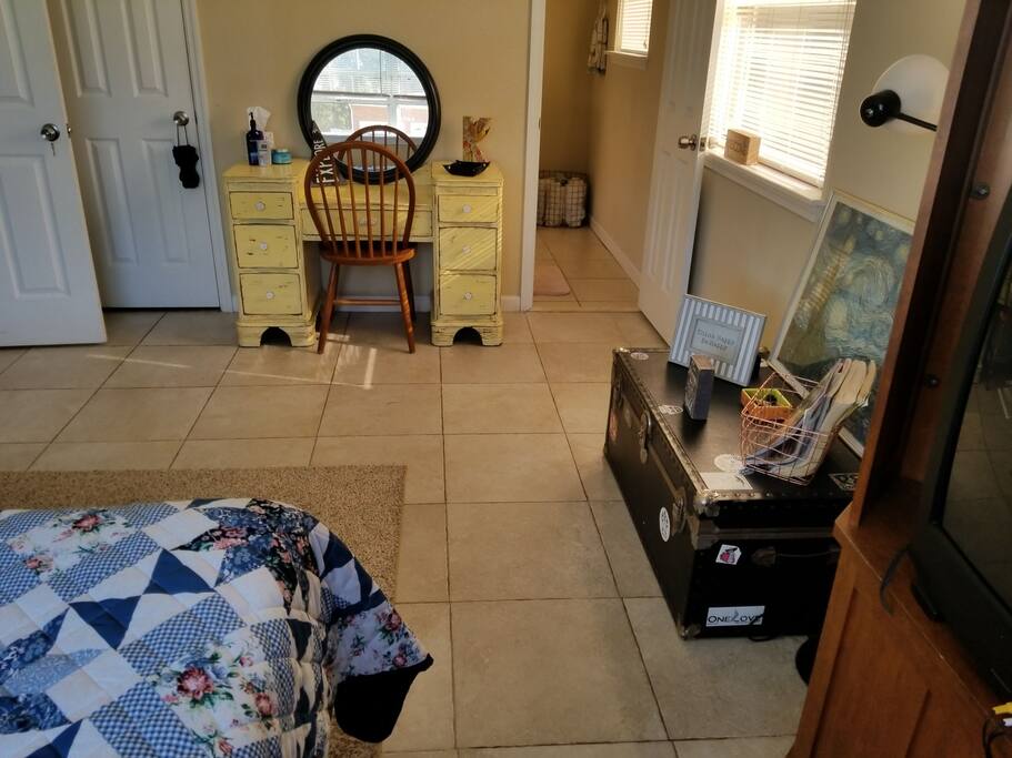 Vanity space with mirror, guests may utilize this space for cosmetics or as a desk for those traveling for business!