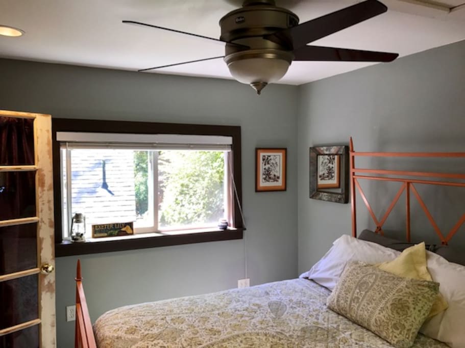 Bedroom with two big windows w/ screens