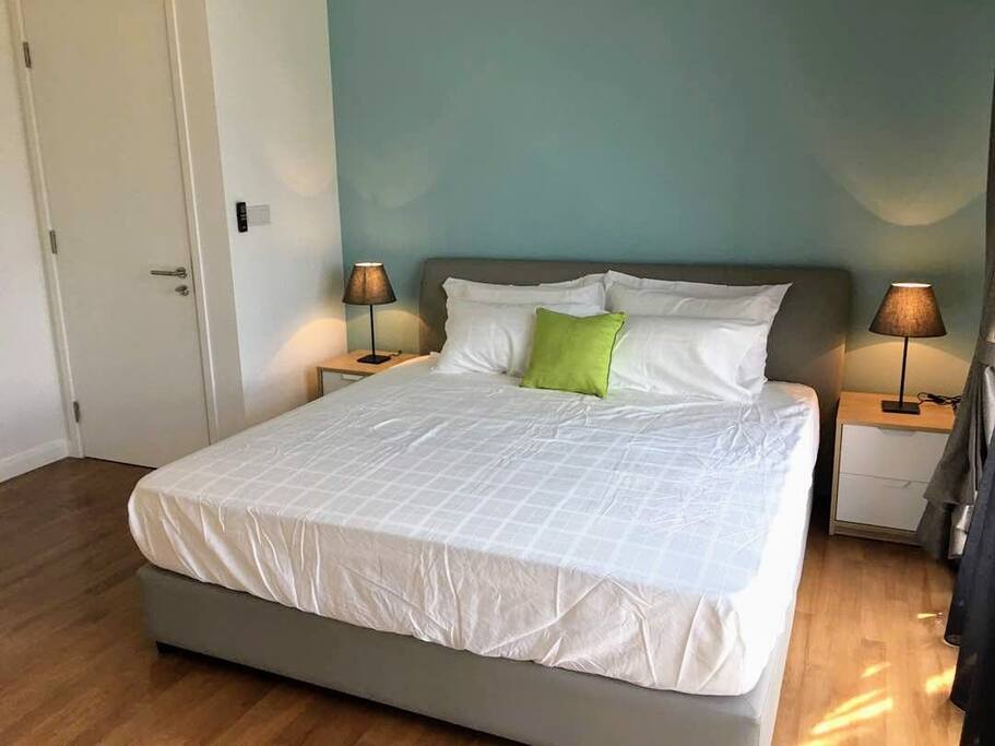King Size Master Bedroom with sunlight.