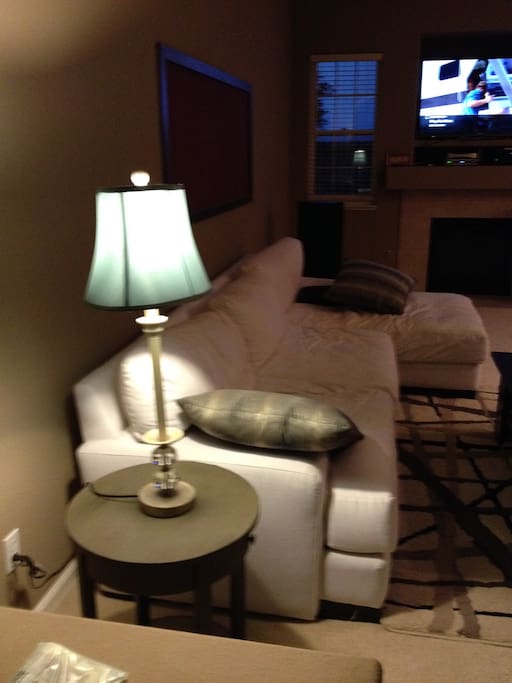Artistically decorated living space, large tv