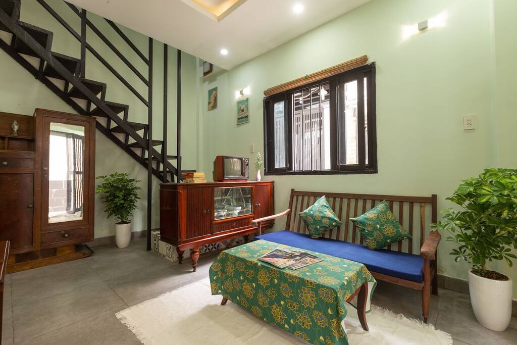 Warm and welcoming living room. With dining table and fully facilitated kitchenette.