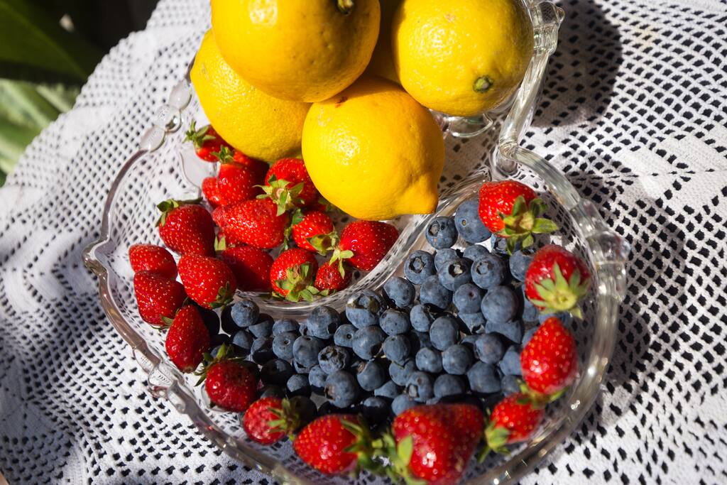 Enjoy fruits on table in terrace