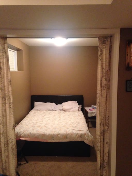 Extra bedroom with double bed. No door but closing curtans.