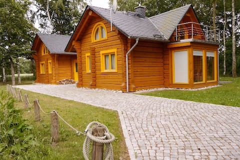Top Airbnb: Romantic wooden house with fireplace and sauna house in Fuhlendorf