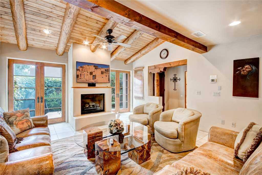 Spacious Living Room - Large comfortable couches, cable HDTV, and ceiling fan so you can enjoy your evenings with family and lots