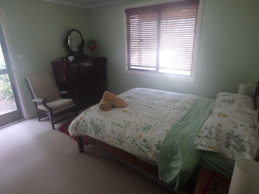 Bedroom with chest of drawers and chair
