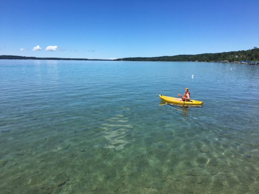 Care for a Kayak? The crystal clear water of Torch Lake is mere steps away.