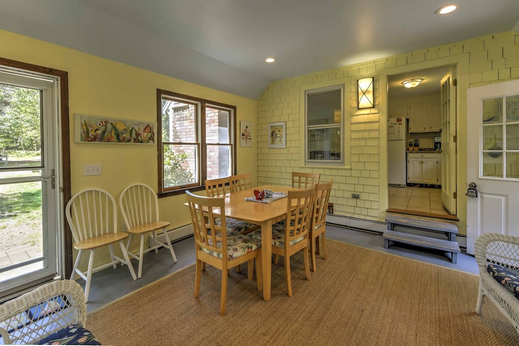 Enjoy a breezy lunch in this sunroom just off the kitchen.