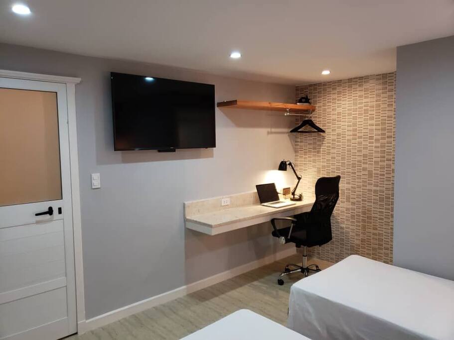 tv 51 inches, iron, hangers, desk to work with your lapto