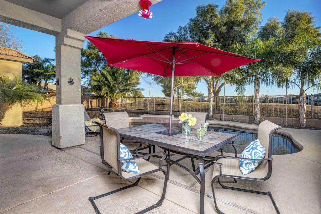 Backyard dining table with umbrella