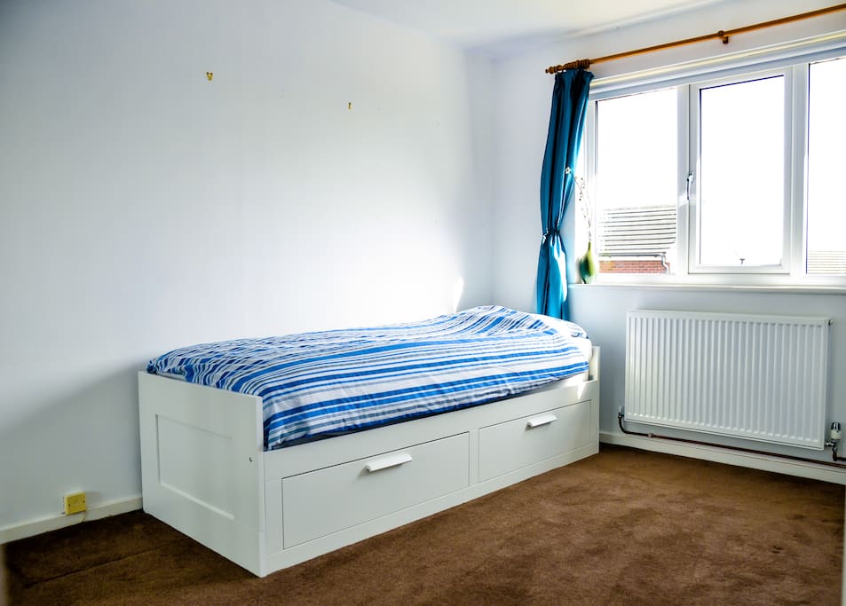 Double bedroom with storage and build in wardrobe and extendable single and/or double bed.