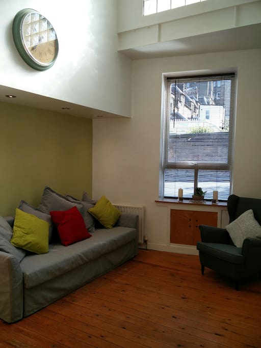 Bright living area with sofa bed