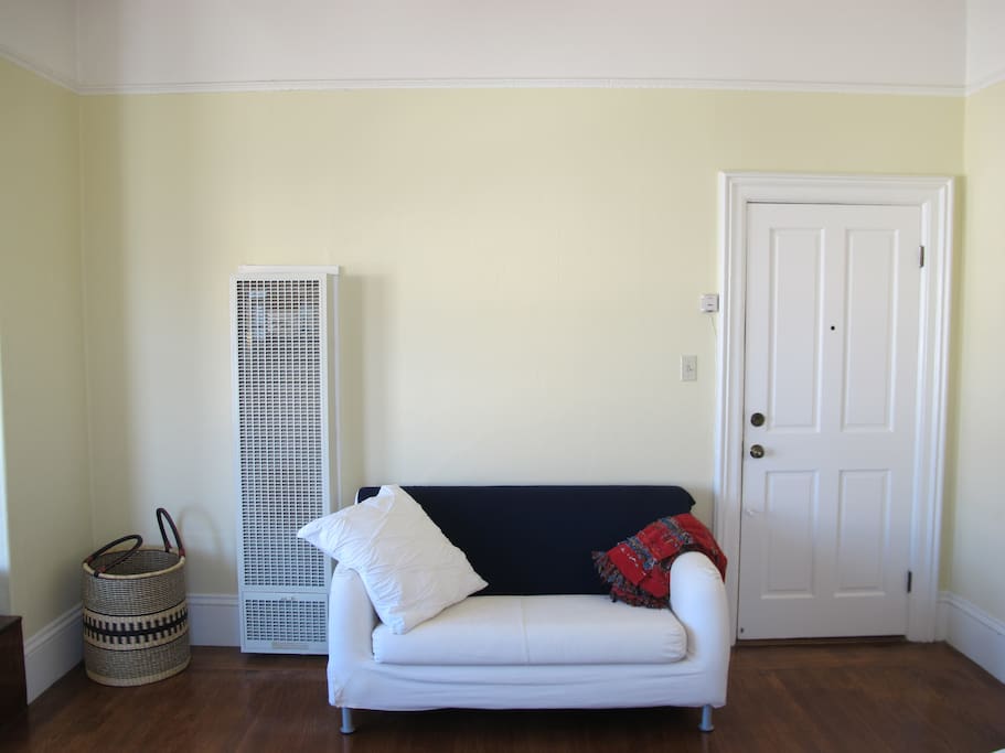 Main room with heater and loveseat sofa