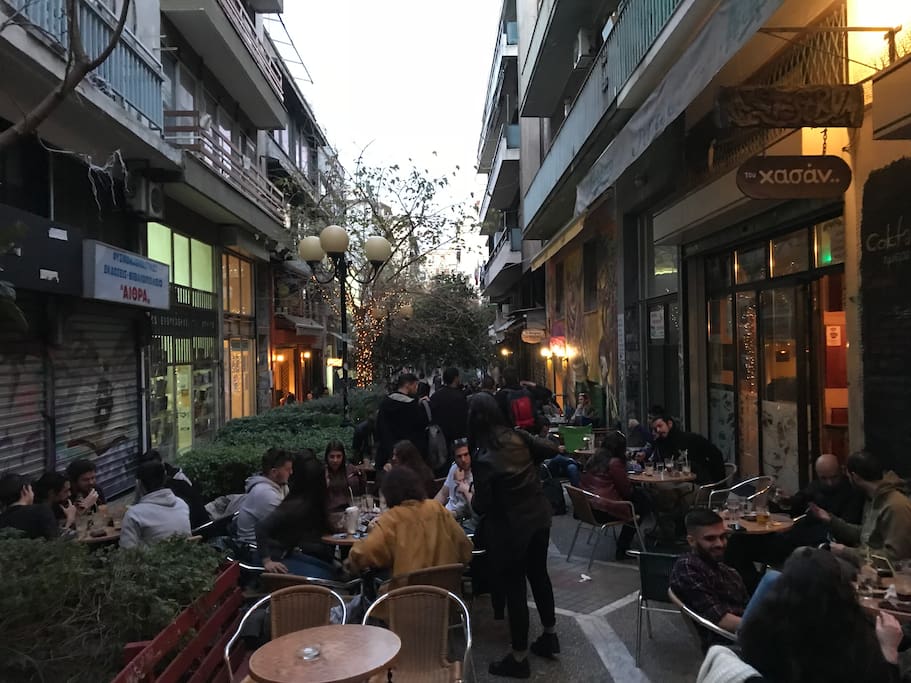 Coffee shops and bars just under your legs. The heart of Exarchia is here