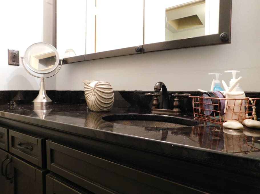 The sink area is separated from the bath with a pocket door for added privacy.