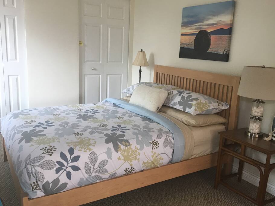 Cozy bed facing windows