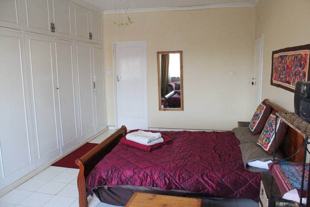 Bedroom - small door goes to private toilet/sink.