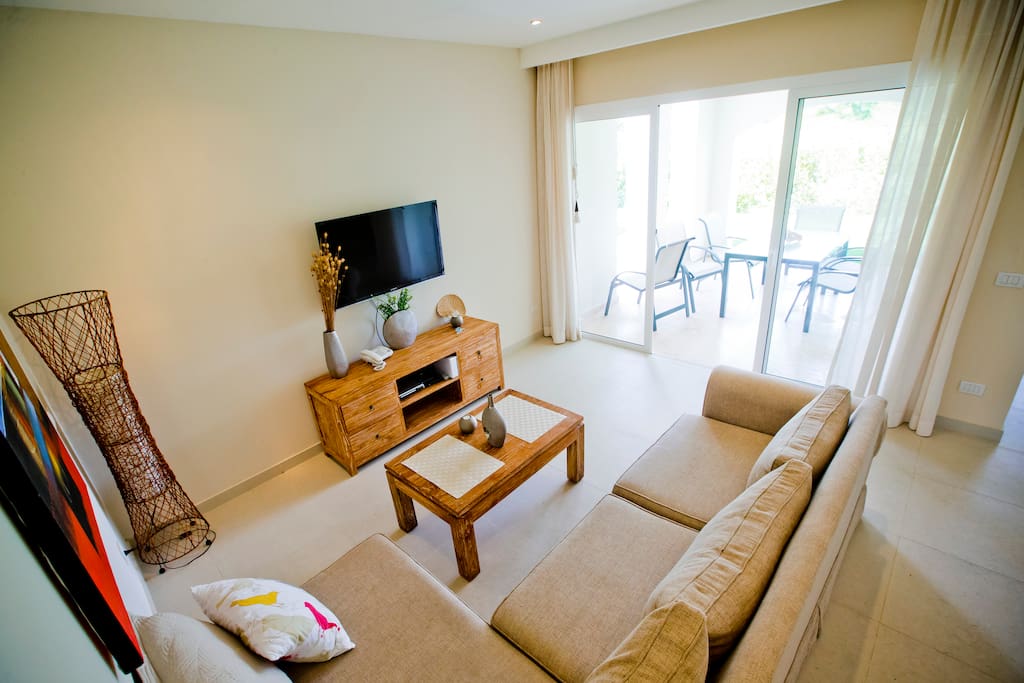 Here's a living room with wide patio doors and a lot of room for having a great time with your family or friends