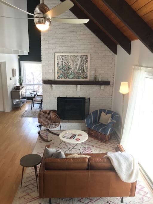 Living room with working fireplace, open to the kitchen and dining room