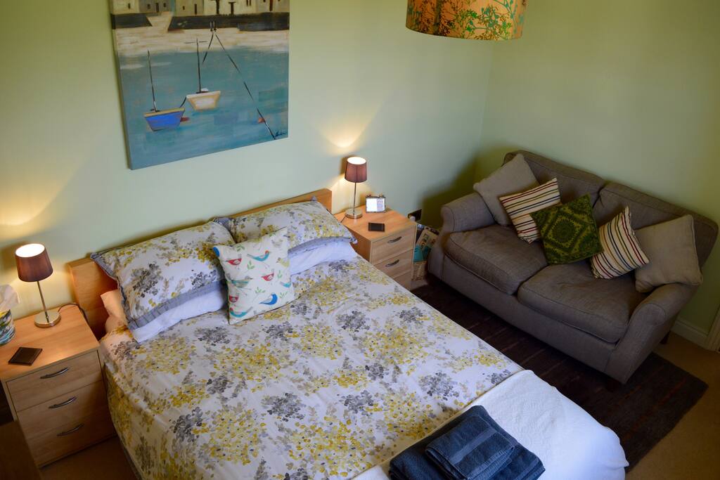 Comfy guest room with sofa for relaxing