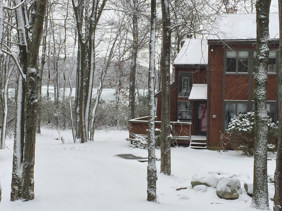 Winter view to townhouse with lake in background