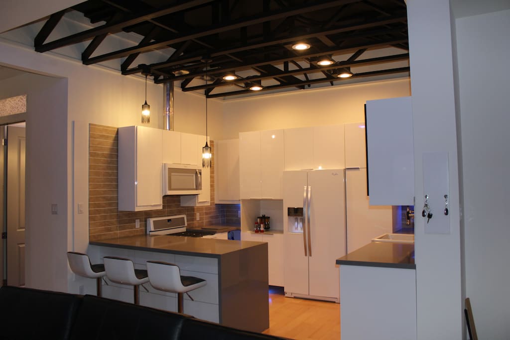 Kitchen with all major appliances and blender. Bar seating.