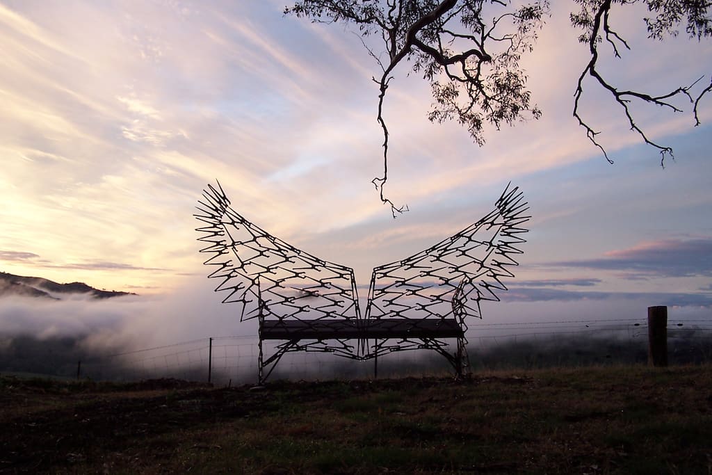 Wing Chair with fog over valley