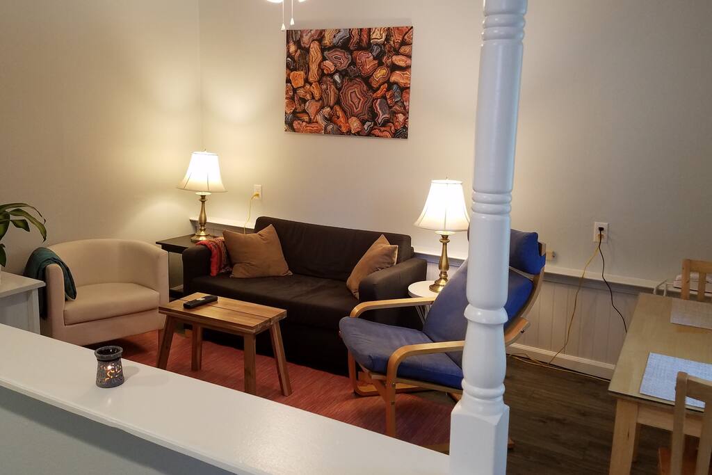 Relax in a comfy-cozy living room with seating for 4, pullout "European Small Double" pullout sofa, plenty of lighting, ceiling fan, HDTV, cable TV, built-in Netflix, HBO, DVR.