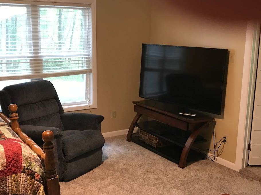 Master bedroom tv and comfy chair