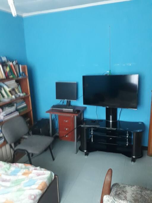 It has led tv and desktop computer in the room and english books.