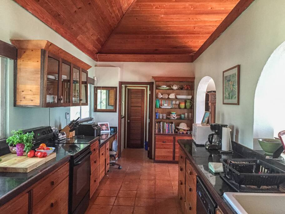 The kitchen is filled with a large variety of pots, dishes, glassware and more!