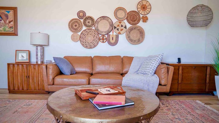 This oversized bonus room can host your entire household. Highlights include a full murphy bed that can be neatly stored when not in use, large TV and sound bar and an antique secretary desk w/ crystal inkwell that's perfect to set up your laptop