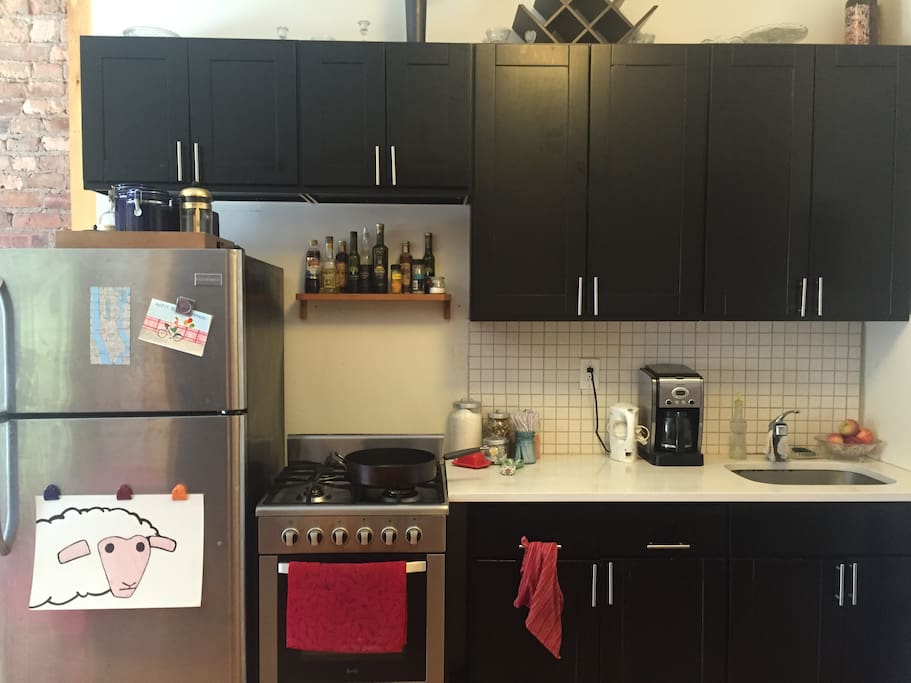 Gas oven & stove, electric kettle and coffee maker.
