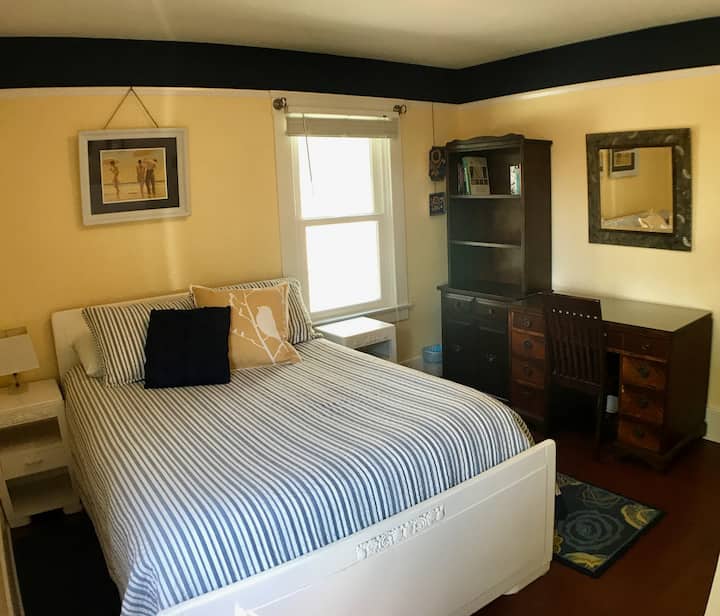 Back bedroom has a full bed. Access to back patio is through this room