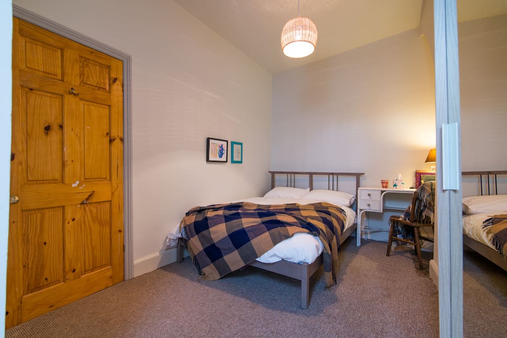 Private double room with standard double bed and vintage dresser